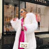 Exotique Long Fur Coat in Snow